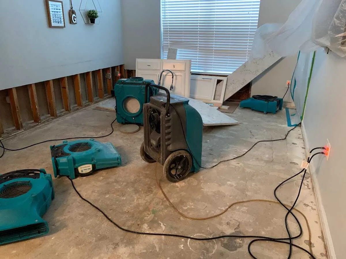 Dehumidifier in flood-cut room for Water Damage Restoration in Garden Home-Whitford